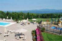 The outdoor pool deck at Steele Hill in the summer