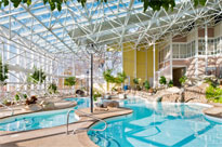 The large indoor pool area and waterslide at Steele Hill West