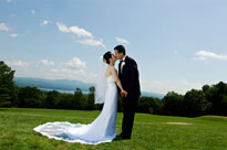 A bride and groom infront of the view at Steele Hill