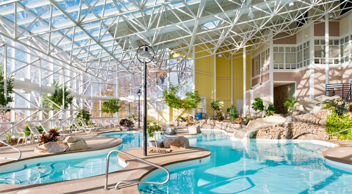 The large indoor pool area and waterslide at Steele Hill West