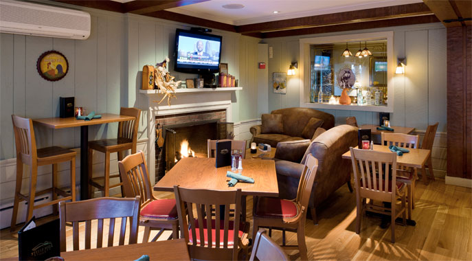 The cozy fireplace and comfortable seating in Tova's Tavern